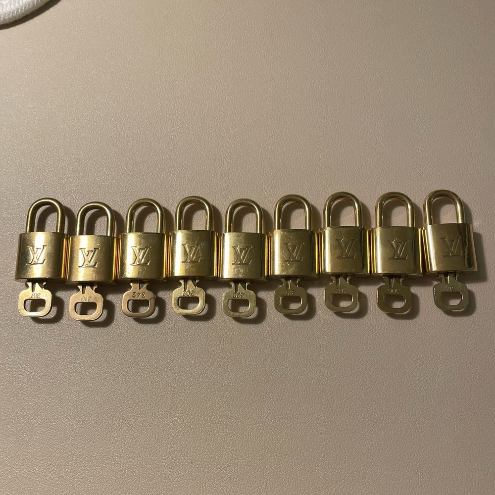 (1) Louis Vuitton Gold Lock and key